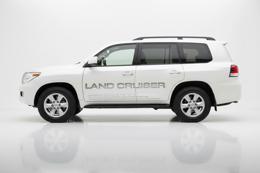 White Land Cruiser with text graphics facing left